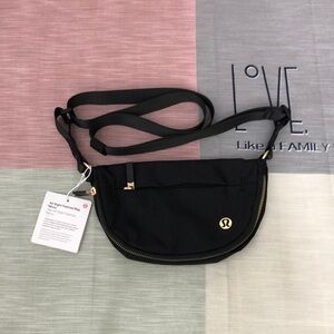 Lululemon Athletica Black and Gold Crossbody Bag